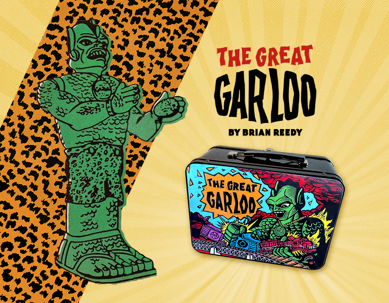 The Great Garloo original green drawing appears next to a black metal lunch box with The Great Garloo on the front of the lunch box.