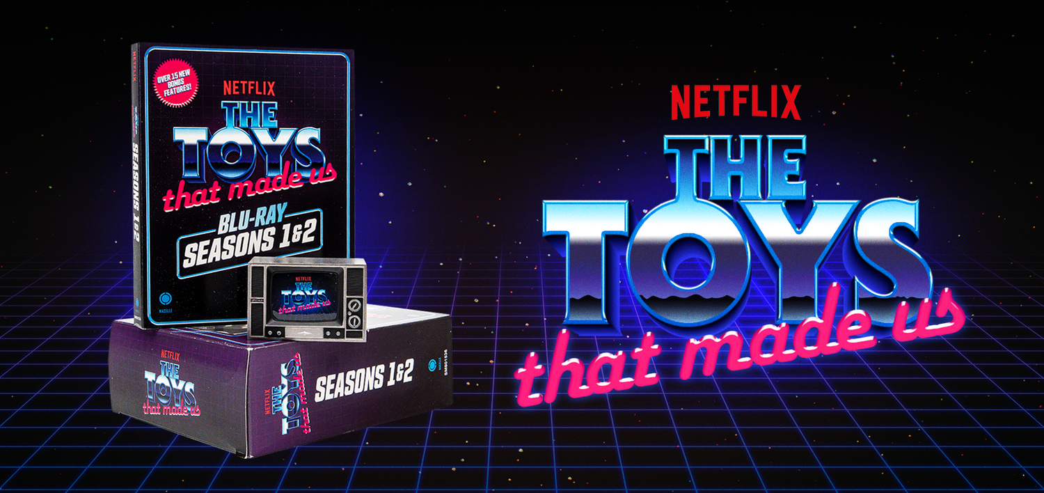 Toys that Made Us Blu Ray set with Netflix and The Toys That Made Us logo. A small toy TV set with the Toys that Made Us Logo is on top of the Blu Ray box